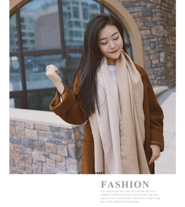 Close-up of soft cashmere-like scarf texture and fringe detail with street fashion style