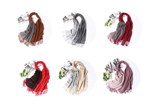 Detail view of two-tone cashmere-like scarves with long tassels in six color combinations