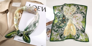 Detailansicht des Seidentuchs mit grünem Blumenmuster und Schmetterlingsflügeln