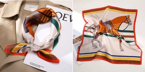 Detailaufnahme des Seidenquadrat-Tuchs mit Reitsport-Print und Satin-Oberfläche