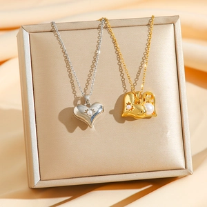 Luxury titanium steel heart necklaces with pearls in gold and silver finish on silk