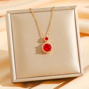 Vintage gold-plated titanium necklace with red gemstones and sparkling crystal accents