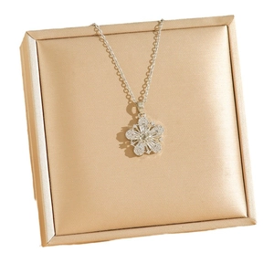 Elegant zircon flower pendant necklace in titanium steel on jewelry box