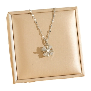 Elegant rotating silver windmill necklace with sparkling zircons and a pearl pendant