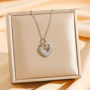 Luxurious silver heart tassel necklace with colorful diamonds and double heart pendant
