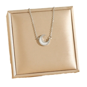 Polished crescent moon necklace with sparkling crystals and mother of pearl inlay