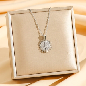 Sparkling silver sunflower heart pendant necklace with shimmering pave zircons on elegant chain