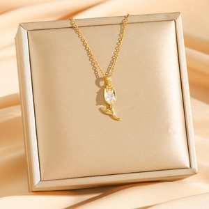 Elegant gold tulip pendant necklace with a white teardrop zircon on a luxury silk base