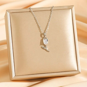 Silver tulip pendant necklace with sparkling teardrop zircon on champagne jewelry box