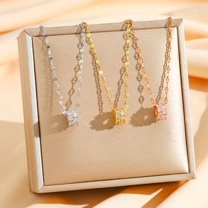 Three-piece set of stylish cylinder necklaces with zircons in silver, gold, and rose gold