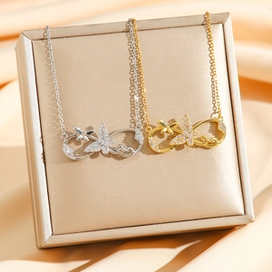 Infinity butterfly pendant necklace with cubic zirconia in gold and silver finish