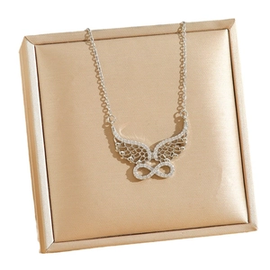 Silver infinity wing necklace with sparkling zircon pavé in a champagne jewelry gift box