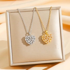 Elegant heart pendant necklaces in gold and silver with shimmering zircon mosaic setting