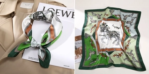 Detail eines Seidenschals mit Reitsport-Motiven in Grün- und Orangetönen