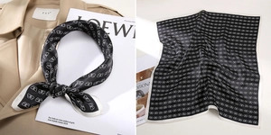 Detail showing square silk scarf with black white bow pattern on trench coat