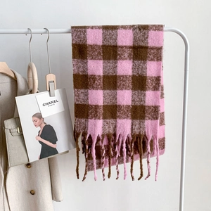 Thick checkered mohair scarf in brown and pink with tassels on a white hanger