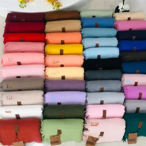 Overview of 41 solid color fringed scarves showing a wide range of available color options