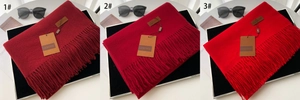 Detailed comparison of three shades of red tassel scarves with premium brand tags