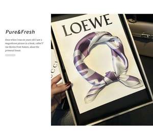 Detailed view of silk square scarf featuring purple tie-dye pattern on elegant display