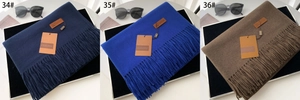 Detailed comparison of thick winter scarves with fringe tassels in navy and royal blue