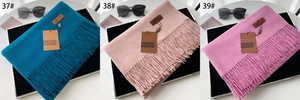 Detailed comparison of three tassel scarves in teal, dusty rose, and fuchsia colors