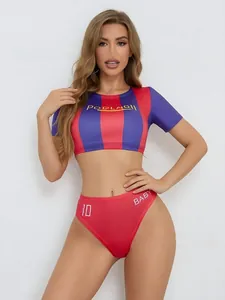 Macro detail of sporty crop top and high-cut bottoms with striped athletic design