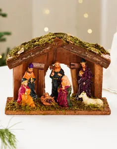 Detailed view of hand-painted wooden nativity set characters inside stable ornament