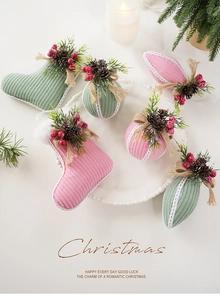 Detail of pink corduroy Christmas stocking with pine cones and red berries decor