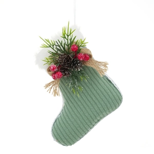 Green corduroy Christmas stocking with white fur trim, pine cones and red berries decor
