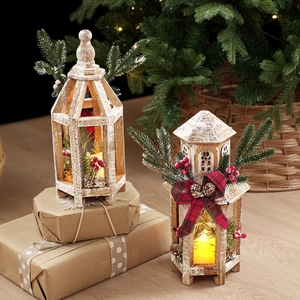 Vintage white wood Christmas lanterns with warm LED candles and pine cone accents