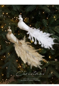 Detailed view of peacock Christmas tree ornaments with sequins and real white feathers