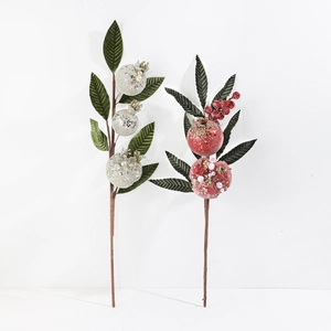 Detail of red and silver artificial pomegranate branches with glitter and pearls