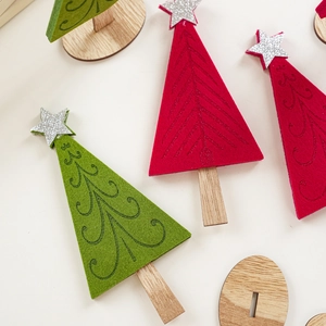 Close-up of red and green felt Christmas trees with spiral patterns and silver stars