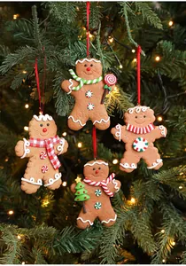 Close-up of four gingerbread man Christmas tree ornaments with festive scarves and lollipops