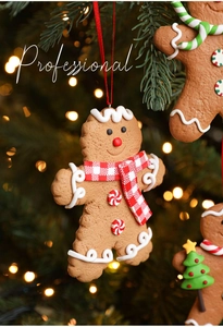 Macro detail of gingerbread man Christmas ornament with red scarf on a green pine tree