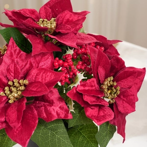 Artificial Christmas poinsettia plant with red velvet petals and gold glitter centers