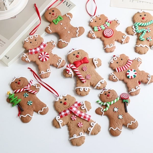 Set of 9 vintage gingerbread man Christmas tree ornaments with festive scarves and props