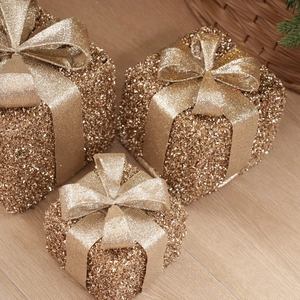 Three-piece set of decorative Christmas gift boxes with gold glitter finish and bows