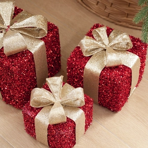 Three-piece set of red glitter Christmas gift boxes with gold bows for festive decor