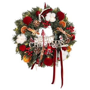Burgundy Christmas wreath with LED lights, pine cones, and Merry Christmas sign
