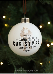 Detalle de bola de Navidad blanca de 8cm con estampado vintage de Papá Noel y cuerda