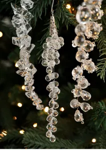 Macro detail of acrylic crystal ice pendants and pearl drops on a Christmas tree