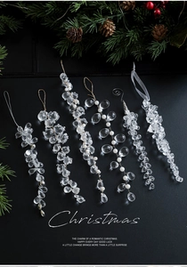 Detail of clear acrylic grape cluster and crystal icicle ornaments for Christmas tree