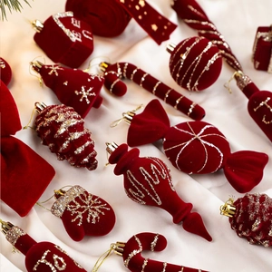 Luxurious burgundy flocked Christmas tree ornaments set with glittery gold snowflake patterns