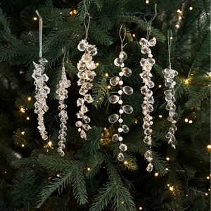 Clear acrylic crystal grape cluster and pearl ornaments set on Christmas tree