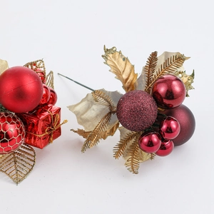 Christmas picks with red baubles, golden leaves and mini gift box on white background