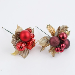 Detail of red berries, mini gift boxes and gold hollow leaves for Christmas floral decor