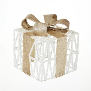 Three-piece white beaded Christmas gift boxes with large gold glitter bows for holiday decor