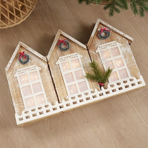 Lighted wooden house ornament with warm LED lights and rustic white fence decoration