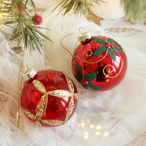 Red 8cm glass Christmas ball ornaments with gold glitter patterns and holly leaf designs